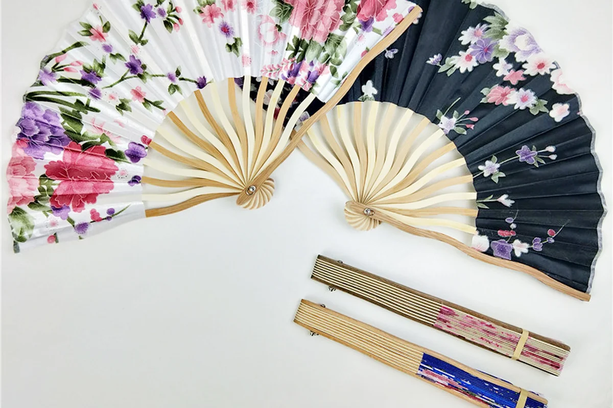 Floral folding fans shown open and folded.