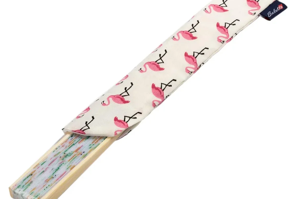 Folded fan partly tucked into a flamingo-print sleeve.