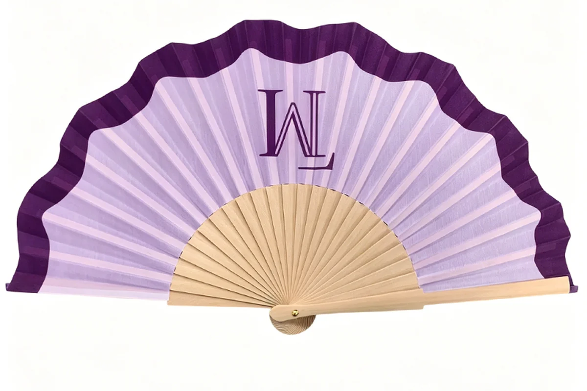 Scalloped purple folding fan with a sample monogram.