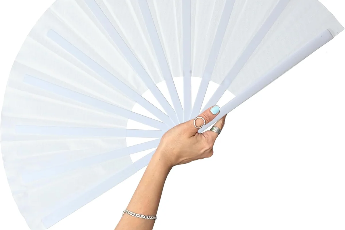 Large white folding fan held open in one hand.