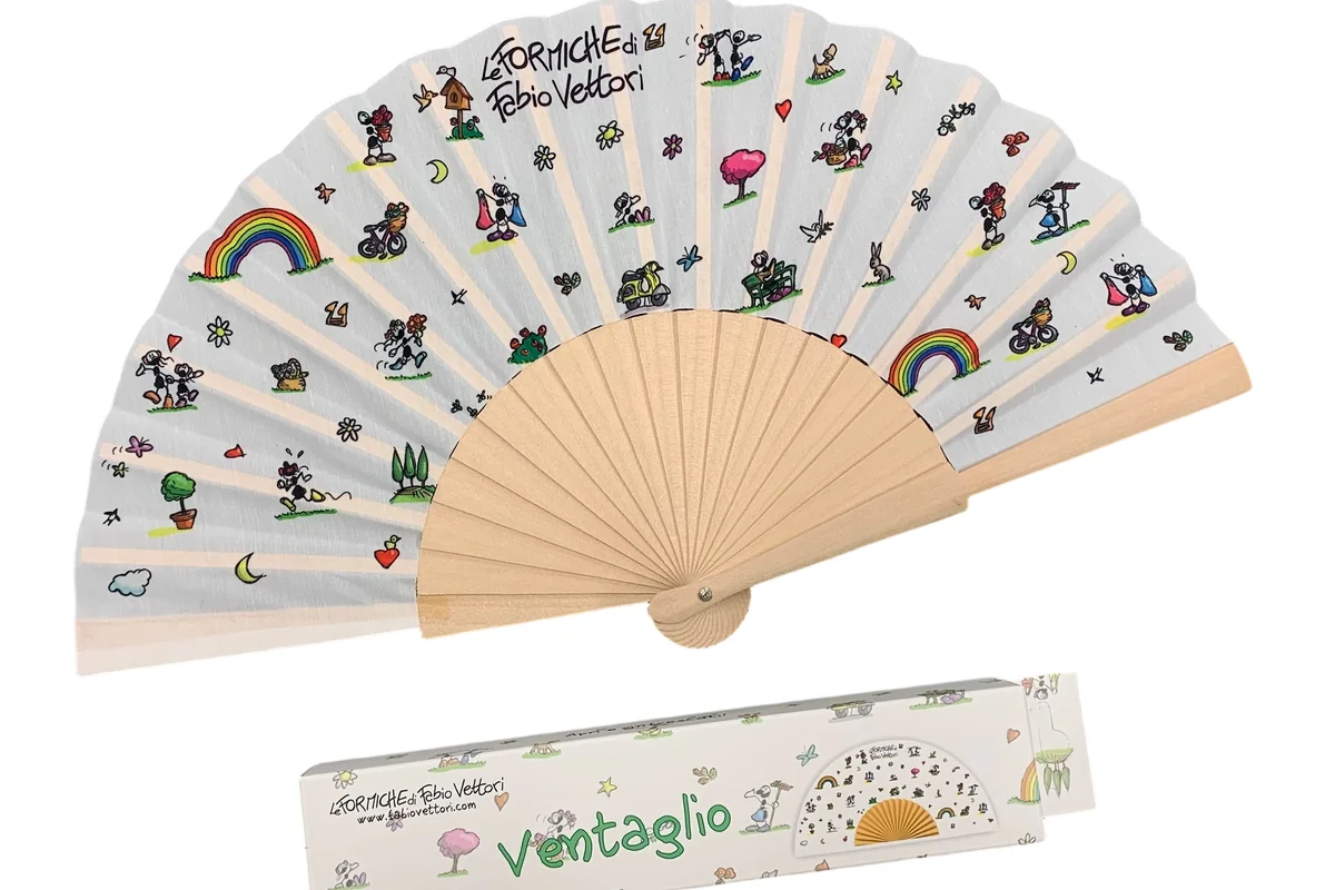 White folding fan with small illustrated motifs and a matching printed box.