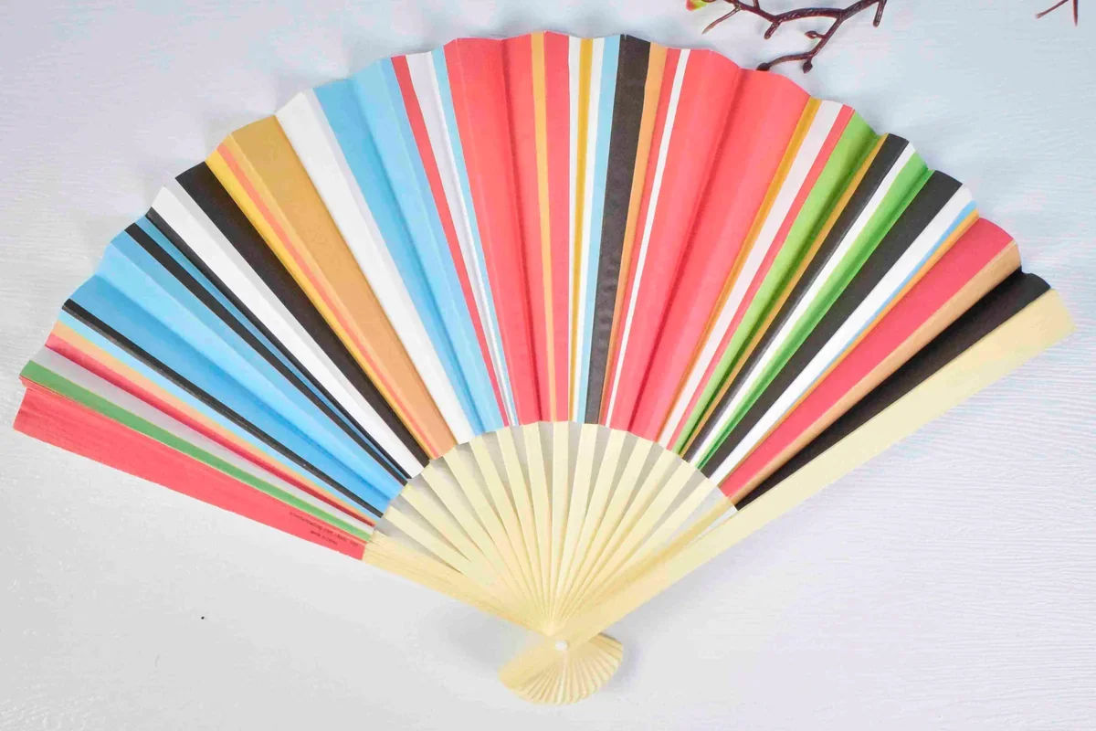 Open folding fan with multicolored stripes.