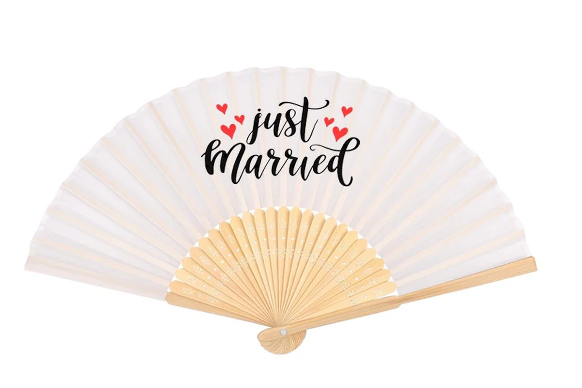 White folding fan with black Just Married lettering and red hearts.