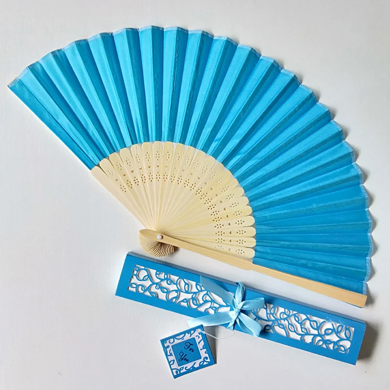 Blue folding fan presented with a coordinated box, ribbon and tag
