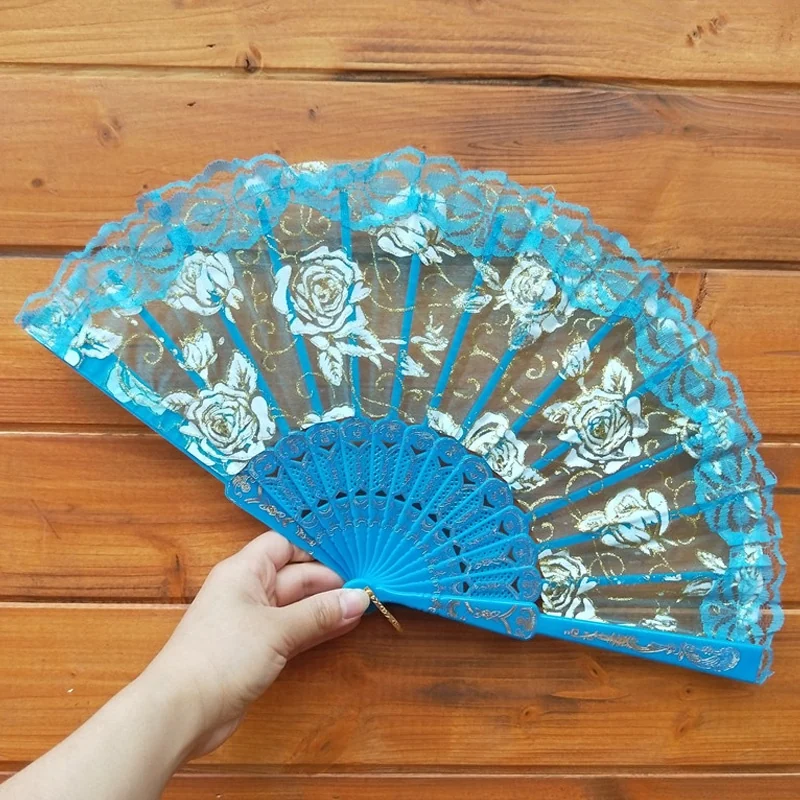Blue floral lace folding fan with a matching ornate blue frame