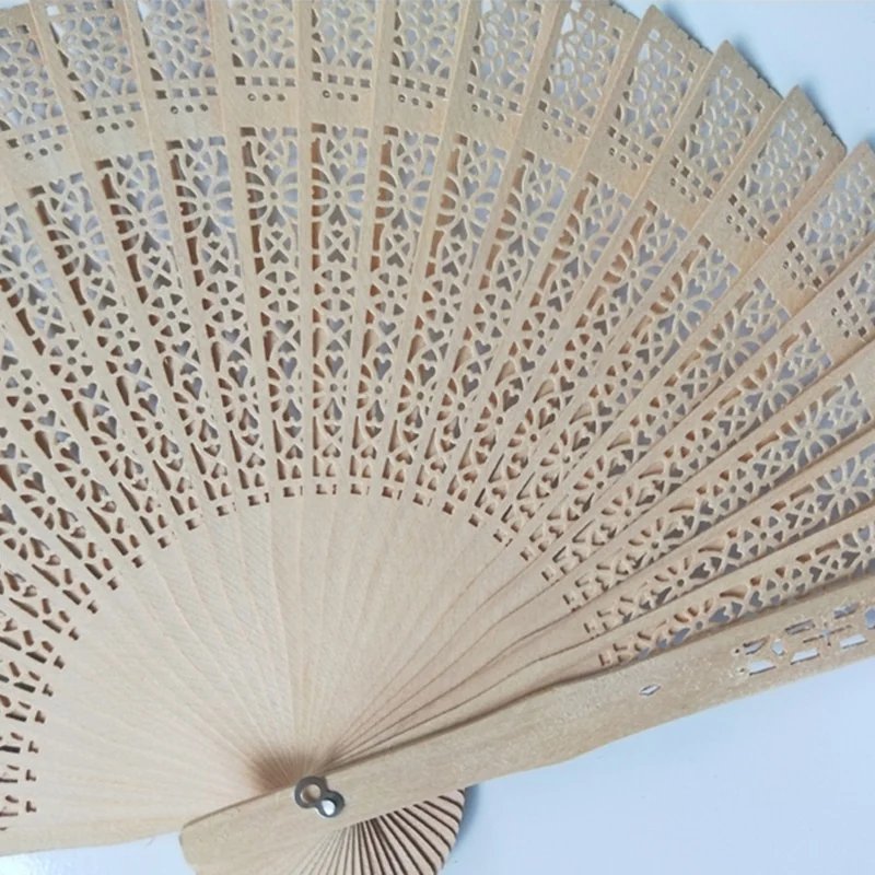 Close view of the natural tone fan showing the repeated openwork detail