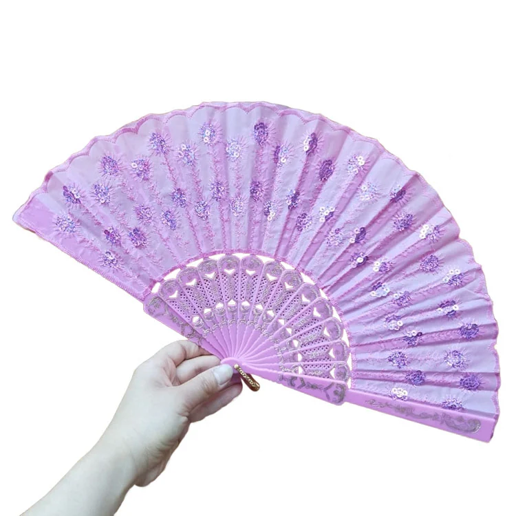 Lavender decorative folding fan with floral details and an ornamental frame