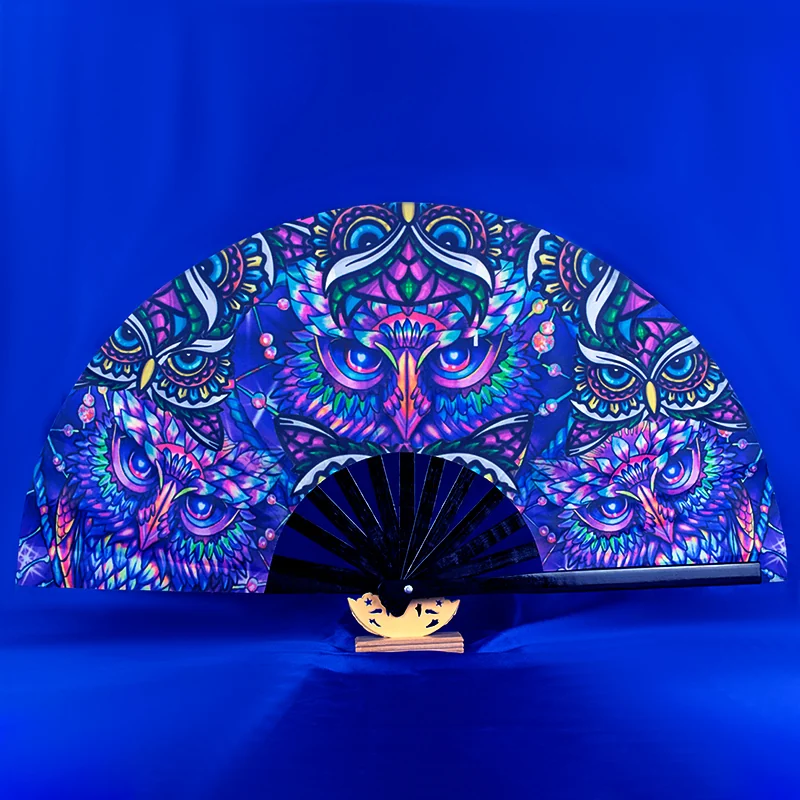 Owl pattern folding fan displayed against a blue background