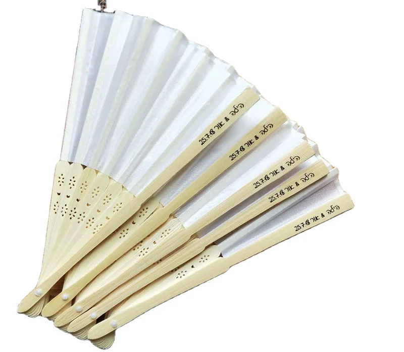 White folding fans with short personalized text on their pale handles