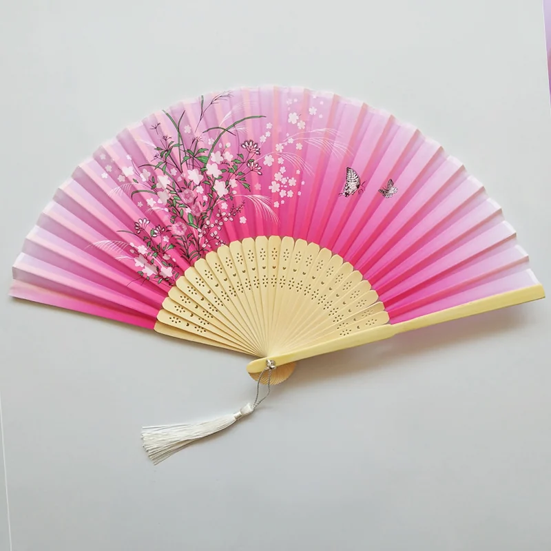 Pink gradient folding fan with blossom branches and a light tassel