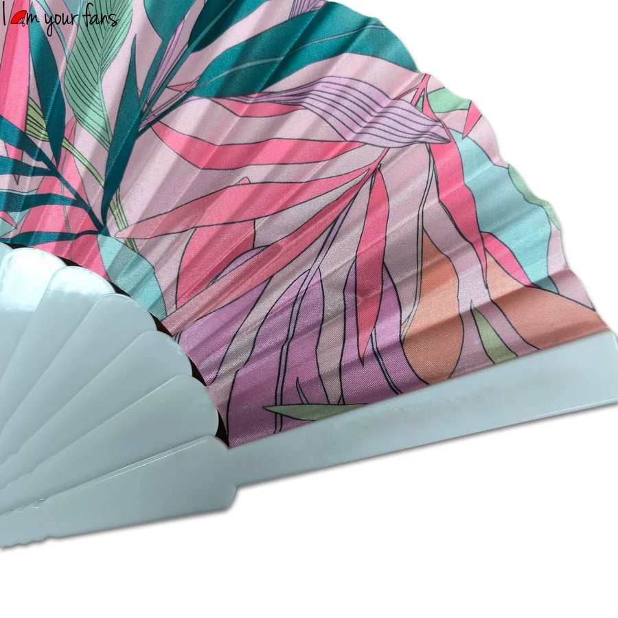 Close view of the tropical leaf print above the pale blue fan ribs