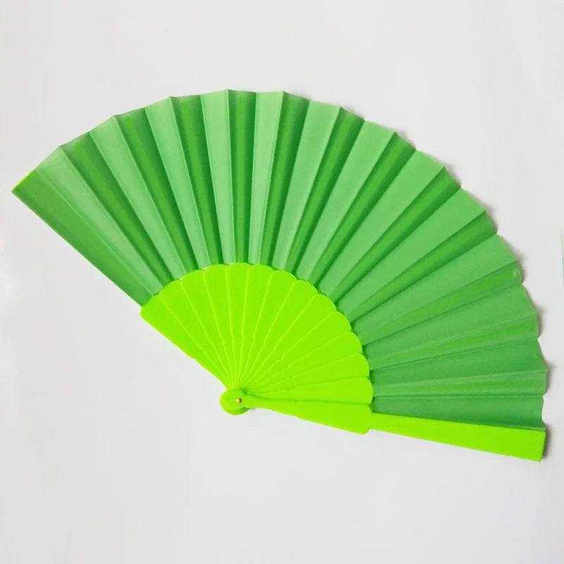 Bright green solid color folding fan shown open