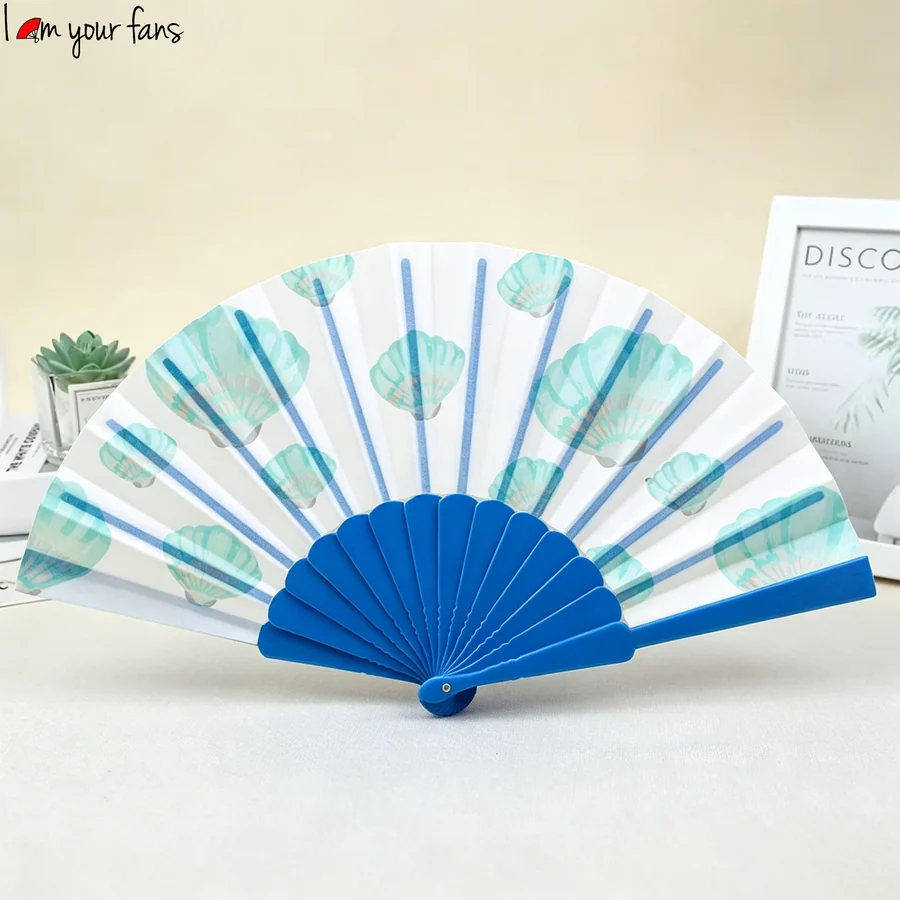 Blue-framed folding fan with green seashell motifs